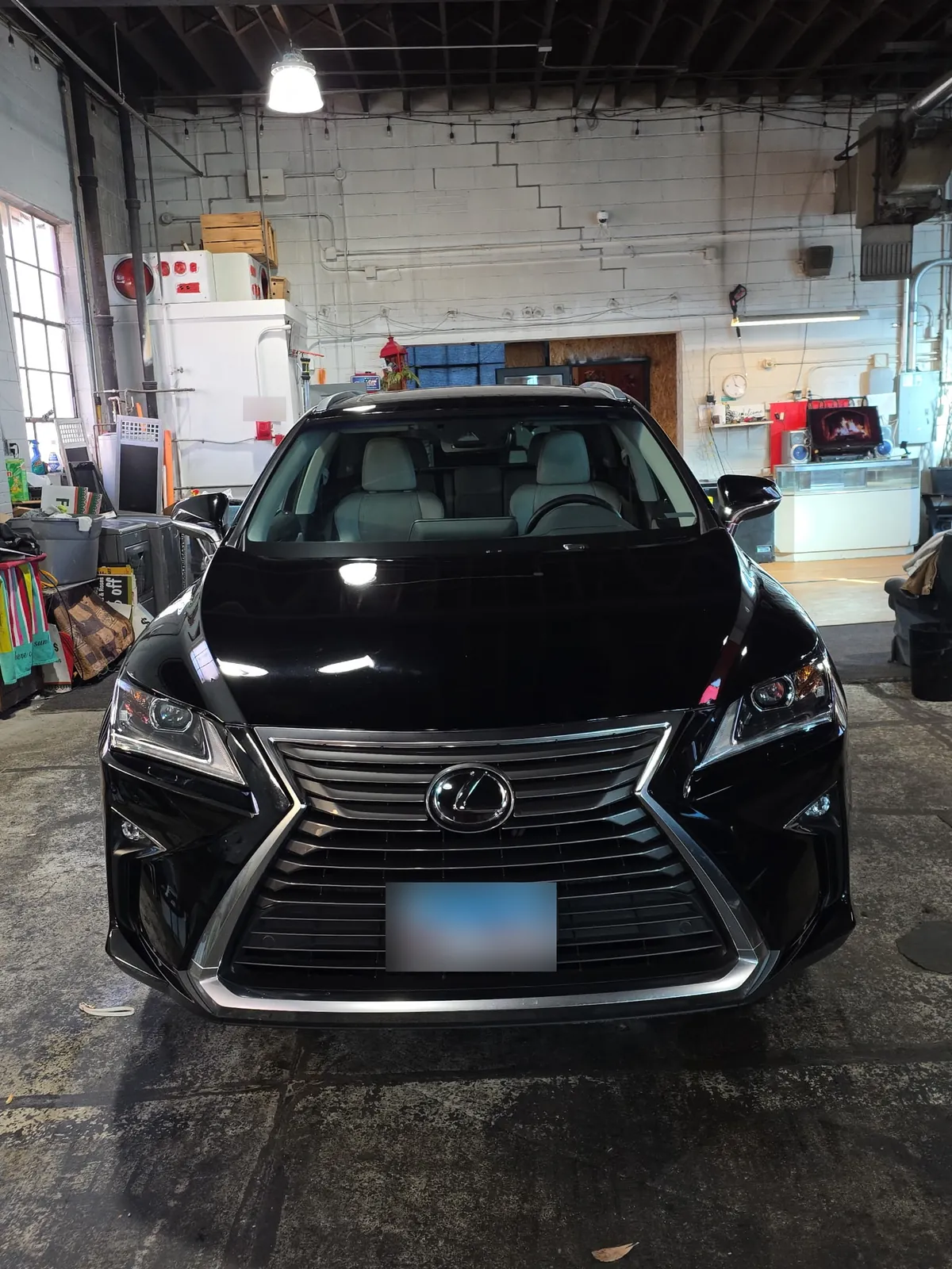 Front of a black Lexus RX after a detail