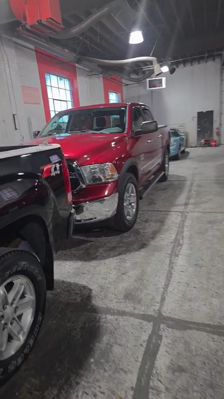Trucks lined up inside the Armor Coatings shop